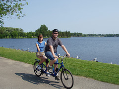 image of a couple biking one of the cheap, fun things to see and do in Ottawa