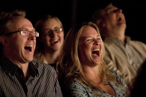image of people laughing at the Absolute Comedy Club one of the fun, cheap, free things to do in Kingston, Ontario